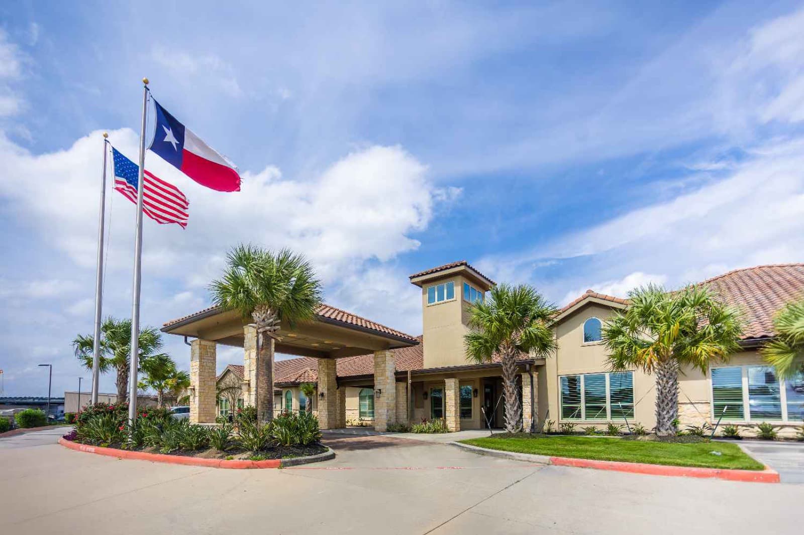 Cathedral Life Centre building entrance with U.S. and Texas flags